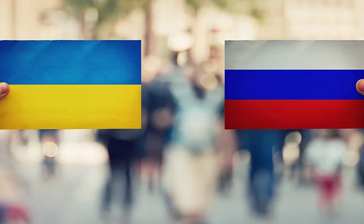People on streets holding Russian and Ukraine flags