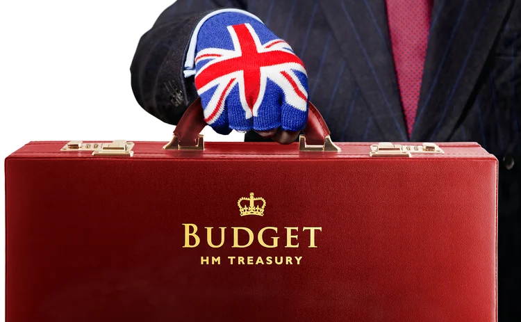 HM Treasury Budget suitcase, man in suit wearing Union Jack glove