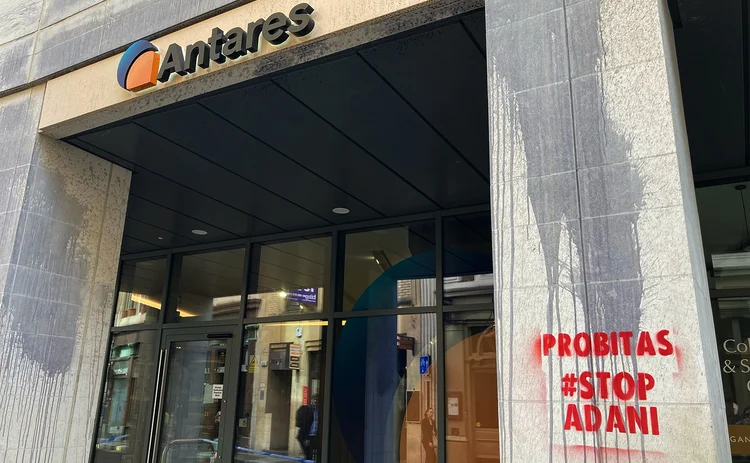 Protest graffiti outside Antares saying Probitas stop adani