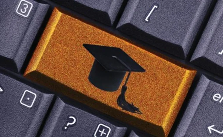 Academic mortarboard symbol on computer keyboard