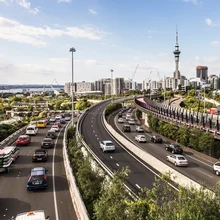 Heavy traffic along the spaghetti junction of various highways in Auckland, New Zealand largest city on a sunny day.