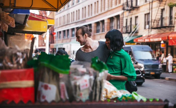 Young multiethnic couple go for local shopping in Chinatown.
