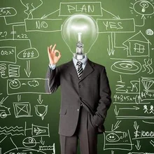 A businessman with a light-bulb head representing an idea